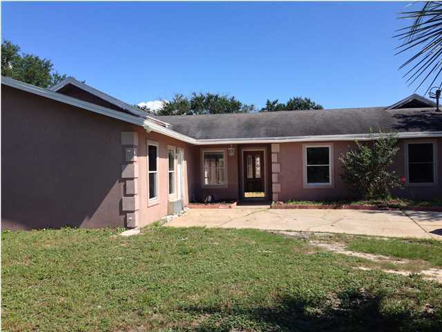 This large home in conveniently located in the heart of Destin. This spacious home of 3400 + sq ft has a new a/c unit for the main house. Tile and carpet throughout, fireplace, mother-in-law suite with separate a/c unit. There are 4 bedrooms and an additional large room that has a separate door and sliding door from the pool with a 1/2 bathroom. Bedrooms in main house has carpeted floors, tile in the kitchen and concrete painted floors in certain areas. Pool and fenced in backyard. Great investment home and home is sold ''AS IS''.