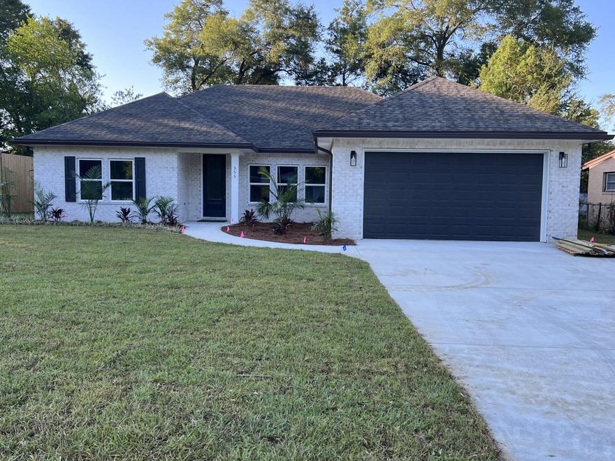 Come see this NEW CONSTRUCTION, CUSTOM BUILT, 4 bedroom, 2 bath home. The seller pays 10,000 towards the buyer's closing cost, doc stamps on the deed& owners title. This all brick home sits on .26 of an acre with no HOA fees. You'll LOVE this OPEN floor plan, featuring 9 ft. ceilings throughout and 10ft where reverse trey ceilings are located. This home boast many custom amenities. Upgraded spray foam insulation in the roof for energy efficiency, 8ft front & garage door, and extra parking pad for a boat or RV. The kitchen is divine, featuring white custom cabinets, soft close drawers, farm sink, gas stove, pantry, undermount lighting under cabinets and quartz countertops throughout. The island bar has an 18 inch over hang, a reverse trey ceiling in the family room with multi color options Enjoy the floor plug added in the family room for phone charges, and lamps without cords hindering walkways.  Love entertaining? The kitchen and family room open up to a screened porch with an extra concrete pad for grilling and an extra patio set. The master bedroom has a trey ceiling with recess lighting and opens to a  custom master bath.  You will absolutely love everything about this bathroom! It's wonderful for relaxing, with endless hot water with the gas tankless hot water heater and the deep soaker tub. The master shower, boast custom tile with a rainhead, 2 separate sprayers, bench for sitting while shaving and seamless glass. You will actually want to do the laundry, with a custom folding table with butcher block, and built in shelves.  When you want to relax and rewind, the back yard is the place. You'll enjoy a fully sodded yard, full gutters, sprinkler system, and a 8 ft. privacy fence, making up-keep easy. This home has everything and sits on a large lot. 
Location is perfect, walking distance to A+school, restaurants, a large park with boat launch and minutes from  restaurants, Eglin Air Force Base, Special Forces, Emerald Coast beaches, shopping, hospitals and more. Call today for a viewing, this won't last long! Home will be completed September 30, 2025.