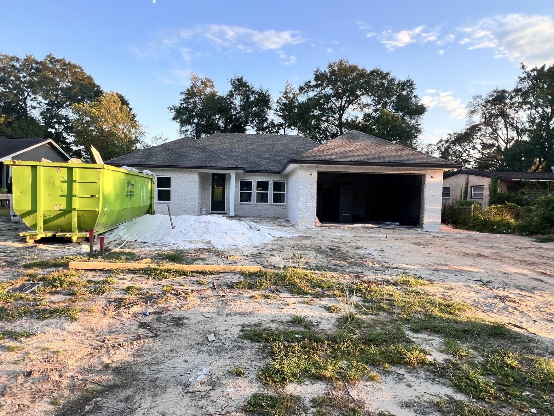 Come see this NEW CONSTRUCTION, CUSTOM BUILT, 4 bedroom, 2 bath home. The seller pays 10,000 towards the buyer's closing cost, doc stamps on the deed& owners title. This all brick home sits on .26 of an acre with no HOA fees. You'll LOVE this OPEN floor plan, featuring 9 ft. ceilings throughout and 10ft where reverse trey or trey ceilings are located. This home boast many custom amenities. Upgraded spray foam insulation in the roof for energy efficiency, 8ft front & garage door, and extra parking pad for a boat. The kitchen is divine, featuring white custom cabinets, soft close drawers, farm sink, gas stove, pantry, undermount lighting under cabinets and quartz countertops throughout. The island bar has an 18 inch over hang, a reverse trey ceiling in the family room multi color options. Enjoy the floor plug added in the family room for phone charges, and lamps without cords hindering walkways. Love entertaining? The kitchen and family room open up to a screened porch with an extra concrete pad for grilling and an extra patio set. The master bedroom has a trey ceiling with recess lighting and opens to a custom master bath. You will absolutely love everything about this bathroom! It's wonderful for relaxing, with endless hot water with the gas tankless hot water heater and the deep soaker tub. The master shower, boast custom tile with a rainhead, 2 separate sprayers, bench for sitting while shaving and seamless glass. You will actually want to do the laundry, with a custom folding table with quartz countertop, hanging bar and custom designer hooks attached above. When you want to relax and rewind, the back yard is the place. You'll enjoy a fully sodded yard, full gutters, sprinkler system, and a privacy fence, making up-keep easy. This home has everything and sits on a large lot.
Location is perfect, walking distance to restaurants, just minutes from A+ schools, Eglin Air Force Base, Special Forces, Emerald Coast beaches, shopping, hospitals and more. Call today for a viewing, this won't last long! Home will be completed September 30, 2025.