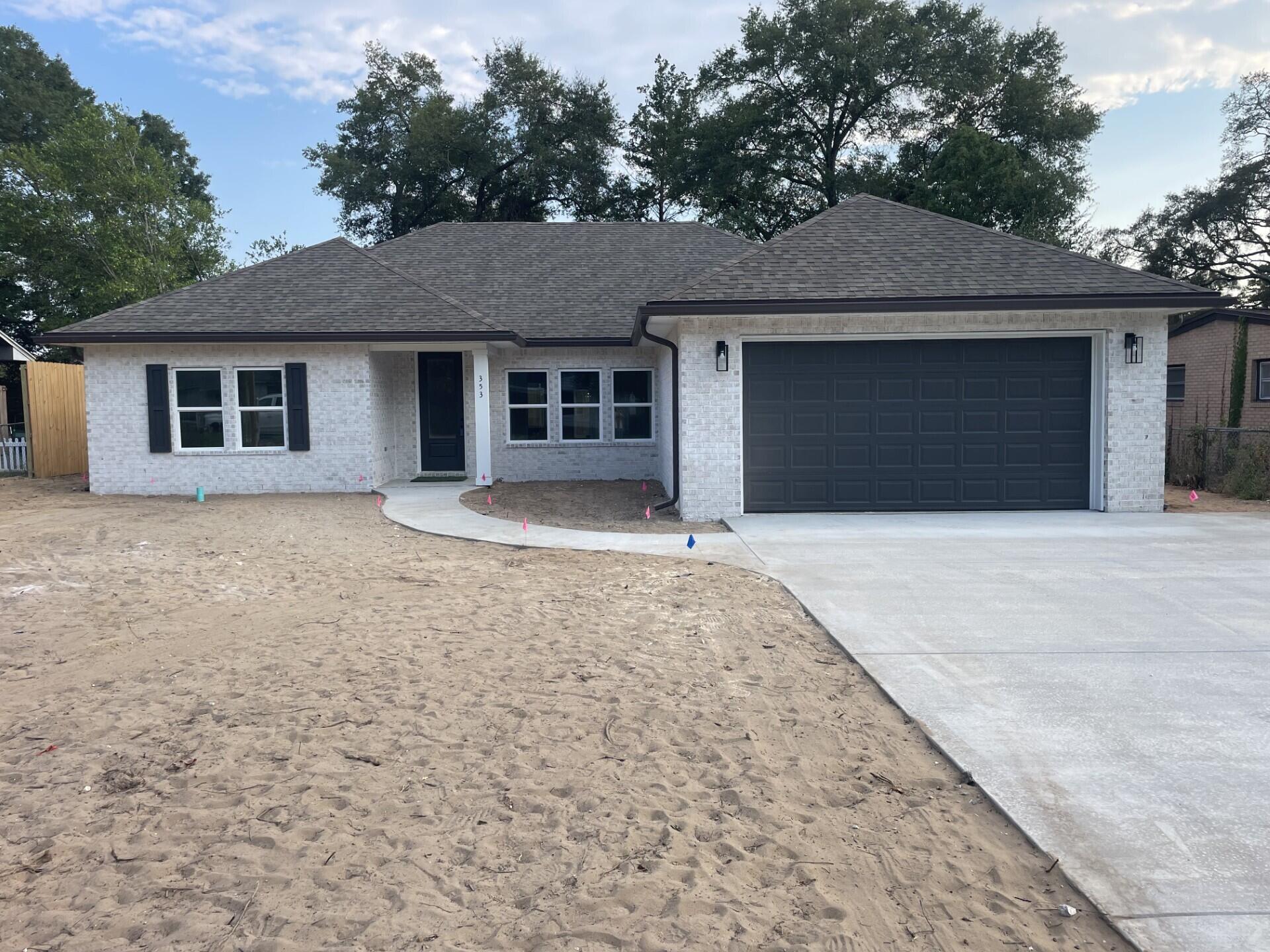 Come see this NEW CONSTRUCTION, CUSTOM BUILT, 4 bedroom, 2 bath home. The seller pays 10,000 towards the buyer's closing cost, doc stamps on the deed& owners title. This all brick home sits on .26 of an acre with no HOA fees. You'll LOVE this OPEN floor plan, featuring 9 ft. ceilings throughout and 10ft where reverse trey ceilings are located. This home boast many custom amenities. Upgraded spray foam insulation in the roof for energy efficiency, 8ft front & garage door, and extra parking pad for a boat or RV. The kitchen is divine, featuring white custom cabinets, soft close drawers, farm sink, gas stove, pantry, undermount lighting under cabinets and quartz countertops throughout. The island bar has an 18 inch over hang, a reverse trey ceiling in the family room with multi color options Enjoy the floor plug added in the family room for phone charges, and lamps without cords hindering walkways. Love entertaining? The kitchen and family room open up to a screened porch with an extra concrete pad for grilling and an extra patio set. The master bedroom has a trey ceiling with recess lighting and opens to a custom master bath. You will absolutely love everything about this bathroom! It's wonderful for relaxing, with endless hot water with the gas tankless hot water heater and the deep soaker tub. The master shower, boast custom tile with a rainhead, 2 separate sprayers, bench for sitting while shaving and seamless glass. You will actually want to do the laundry, with a custom folding table with quartz countertop, hanging bar and custom designer hooks attached. When you want to relax and rewind, the back yard is the place. You'll enjoy a fully sodded yard, full gutters, sprinkler system, and a 8 ft. privacy fence, making up-keep easy. This home has everything and sits on a large lot.
Location is perfect, walking distance to A+school, restaurants, a large park with boat launch and minutes from restaurants, Eglin Air Force Base, Special Forces, Emerald Coast beaches, shopping, hospitals and more. Call today for a viewing, this won't last long! Home will be completed September 30, 2025.