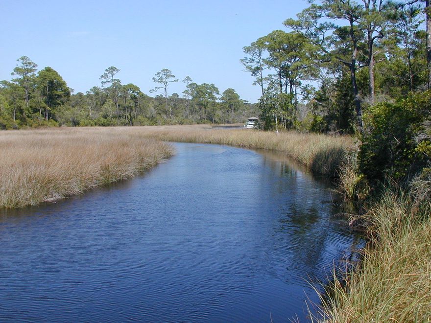 This lot is located in a private community, in a cul-de-sac, across from the stair to the deck on the bayou/Lake Powell. Head to the beach on Lake Powell, swim in the community pool, or take you golf cart to 30Avenue, and 30A, for shopping and dining. The Preserve at Inlet Beach is well situated to all these amenities, and activities.
