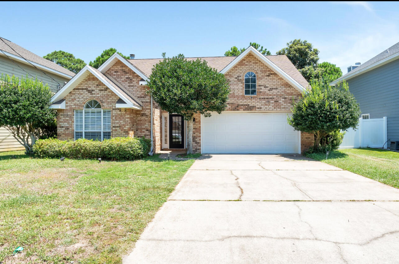 Come and take a look at this stunning 3-bed, 2-bth home, boasting a serene lakefront view that promises tranquility and relaxation. Conveniently located between Destin and Sandestin, this charming residence offers easy access to shopping centers, pristine beaches, world-class golf courses, and a myriad of recreational activities. As you step inside, you'll be greeted by an inviting open concept layout featuring a spacious living area adorned with a beautiful fireplace. The freshly painted interiors and updated appliances make this single-family home move-in ready, ensuring you feel right at home.The spacious kitchen, designed for both functionality and style, it features a large island, perfect for entertaining friends and family, complemented by sleek stainless steel appliances and elega