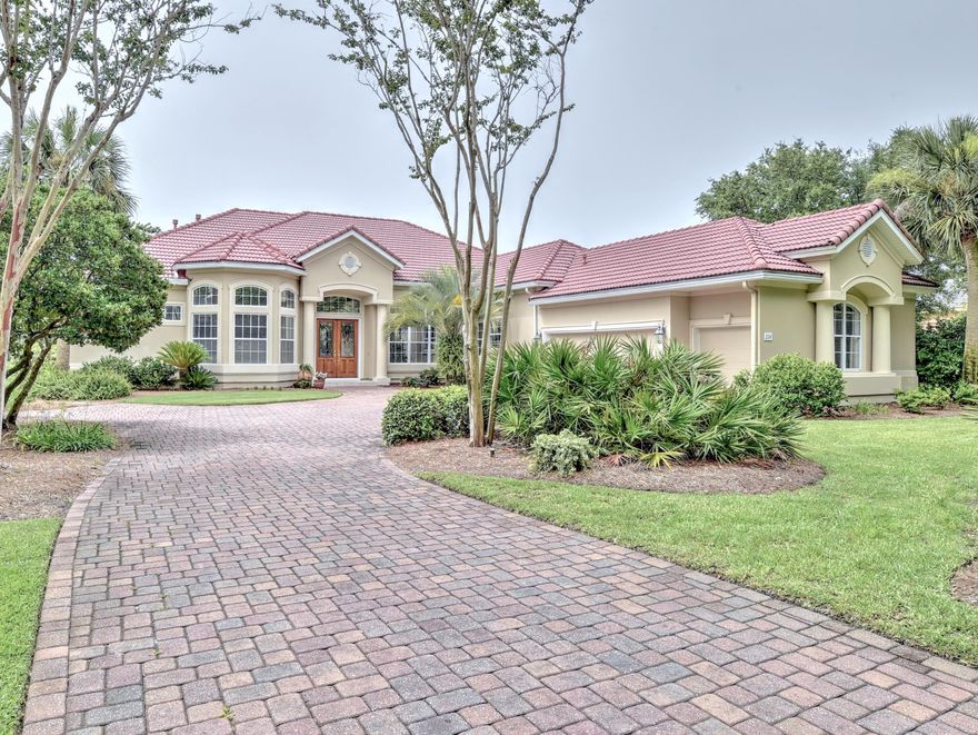 FINANCING FELL THROUGH. Your approach to this highly customized Mediterranean style home, with perfectly kept lush green lawn and landscaping, will take your breath way. Your first reaction is ''Stunning, I want this home!'' The paver driveway compliments the home's design. The front full-length windows with arched transoms add to the beauty of this home.The home has a two-car garage, golf cart garage, and two windows to light up the garage. There is great storage area in the garage also.Great thought was given in the placement of this home on a premium lot. The home captures breathtaking views of the large expanse of Lake Rangia.Views from inside the home of the lake, lanai and pool, can instill immediate calm from most areas of the home.Let your journey begin into ...