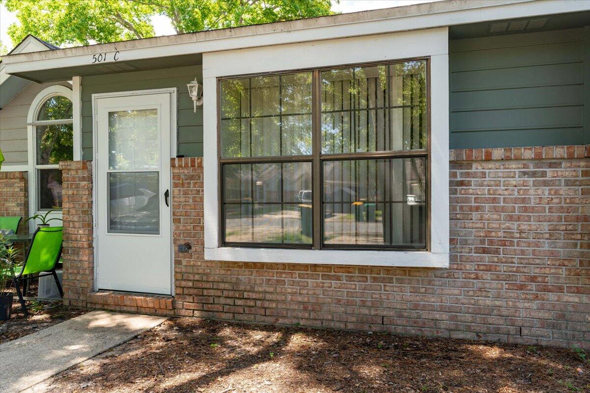 Welcome to this charming single-story townhome nestled in a prime location close to the Northwest Florida campus and the back gate of Hurlburt Field. Perfectly petite yet spacious enough for comfortable living, this residence offers convenience and coziness in equal measure. As you step inside, you're greeted by an inviting living and dining combination. The layout is enhanced by a breakfast bar, providing a seamless flow between the kitchen and living areas. With a cathedral ceiling adding a sense of openness, the interior exudes a feeling of warmth and tranquility. The thoughtful design maximizes space while maintaining an effortless elegance throughout. Outside, discover your own private oasis with a fenced backyard, offering an extra layer of privacy.