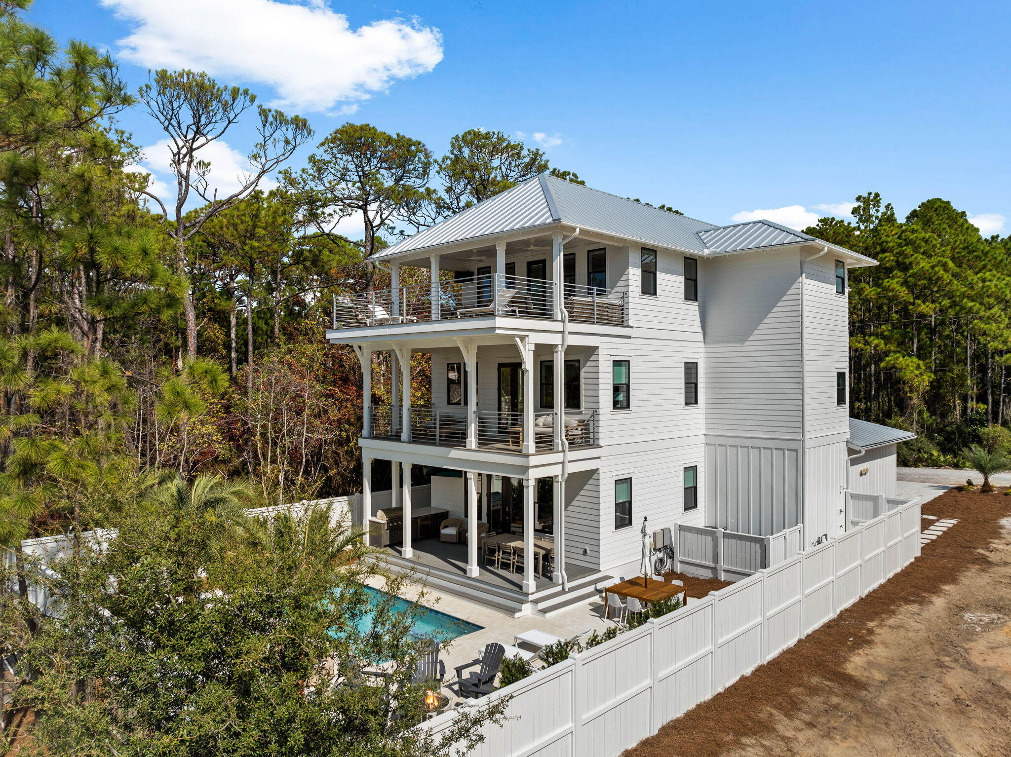 Experience the pinnacle of 30A luxury coastal living with this newly constructed six-bedroom home, featuring an interior expertly crafted by the renowned local firm, Apres Sun, known for their exceptional design work along 30A.  The home is perfectly situated steps to the beach in Seagrove Beach and in close proximity to Seaside. The builder brings their craftsmanship to life, offering a 6-month limited warranty on this stunning masterpiece. Inside, you'll find high-end hardwood floors, custom tiles, and one-of-a-kind countertops in each bathroom, where Kohler and Delta faucets elevate the space to new heights. The gourmet kitchen is a chef's dream, equipped with Viking appliances--including a pot filler--and a spacious pantry with provisions for a potential wine cellar, complete with a dedicated power line for a wine or beverage cooler.

No detail or expense has been spared in the design, materials and finishes. The home is built high and dry with a retaining wall along the north property line providing peace of mind during stormy weather. The home is wrapped in Henry Bluskin for superior waterproofing, it also boasts soundproofing insulation between floors, ensuring a quiet, serene environment. The standing seam roof provides superior weather protection, while the professional landscaping and outdoor lighting enhance the home's curb appeal, making it equally enchanting by day and night.

At over 4,300 square feet, this expansive six-bedroom, six-and-a-half-bathroom home is one of the largest in the area. The outdoor space is an entertainer's dream, featuring a heated pool and spa, a fire pit, and generous seating areas. The oversized third-floor sun deck and entertainment room with a wet bar are perfect for hosting guests or unwinding in style. The zero-maintenance engineered deck and balcony boards ensure both durability and beauty. Newly completed, this home offers the rare opportunity to be the first to experience its pristine condition and unparalleled luxury.

Just steps from the beach with vendor-rented beach chairs at Santa Clara, and less than 1.25 miles to the vibrant Seaside town for dining, shopping, and cultural experiences, this location is truly unbeatable. With rental income projections of up to $288,000 per year, this property offers incredible potential for investors and second-home buyers alike.

Whether you're seeking a personal retreat or a strong cash flowing investment opportunity, this property promises the ultimate coastal lifestyle. Schedule your exclusive viewing today and envision your future in this perfect 30A luxury getaway.
