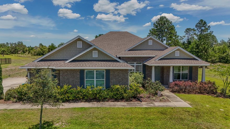 Welcome to 334 Tournament Ln, an exceptional home located in the prestigious, gated golf course community of Windswept Estates. This beautifully designed 3-bedroom, 3-bath home features a versatile flex room, formal dining area, and a spacious 3-car garage. Set on a generous 0.79-acre lot backing up to the 8th fairway, you'll enjoy peaceful golf course  and privacy from your large covered outdoor living space perfect for relaxing or entertaining. Inside, the home features granite countertops, engineered vinyl plank flooring in the main living areas, stainless steel kitchen appliances. The open-concept layout flows seamlessly with a thoughtfully designed split floor plan, offering comfort and function throughout. The private owner's retreat provides a luxurious escape with ample space and style. Just 25 minutes from the sugar-white sands of the Emerald Coast, Windswept Estates offers premier community amenities including a community house, swimming pool, tennis courts, basketball court, and a playground. Don't miss your chance to own this stunning home in one of Freeport's most sought-after communities!