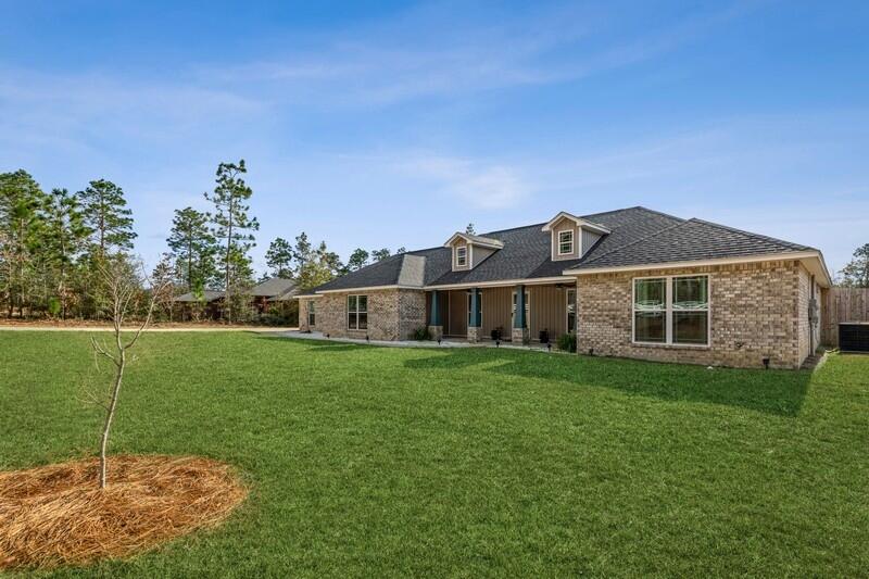 Desirable country living on an acre of land with a triple garage and open bright island kitchen! 4/2 including a large master suite with separate shower and tub and huge walk in closet. 3 additional roomy bedrooms. An office, formal dining area, huge family room and a dream kitchen with plenty of cabinets an island and large pantry. Huge family room that makes it perfect for entertaining. Sliding doors open up to the large covered patio with extended deck. Outdoor living at it's best, large lot, fishing ponds and hiking trail so close! Sellers have added an extended drive behind the fence that allows for a 40ft RV with more room to park other toys.They have also installed 20amp and 50amp hookups for the RV! Make your appointment today!