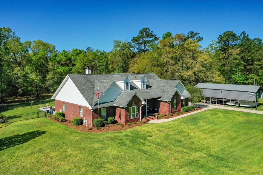 Enjoy country living in attractively designed Home on 2.5 acres, surrounded by large parcels of land. Ideal for entertaining Family and Friends! Your Home search ends here: Custom brick construction,  Florida Rm w/cypress trimmed ceiling, Living Rm w/corner Fireplace (wood or gas), cabinets galore in the country Kitchen, Formal Dining, all overlooking the kidney shaped Pool and deck, spacious 4 BRs, Office w/cypress lined cathedral ceiling and half walls, Master BR Suite boasts a pool view, tray ceiling, oversized double vanity, 12'x5' walk-in closet. 11 ft ceiling in Living Rm + 9 ft ceilings throughout. RV Port in addition to 2-Car Garage, 4 stall dog kennel, and a fenced area perfect for your Horse! Feature List in Documents. High speed internet available. Schedule your viewing today 4th Bedroom was formerly used as a Hobby Room. It has an entry to the garage and a laundry sink. A Chifforobe, freestanding closet, is included since it does not have a closet. Home Warranty is from American Home Shield and is the Shield Essential (additional coverage can be purchased by you). Torn screens will be replaced and damaged RV Port is scheduled for repair.