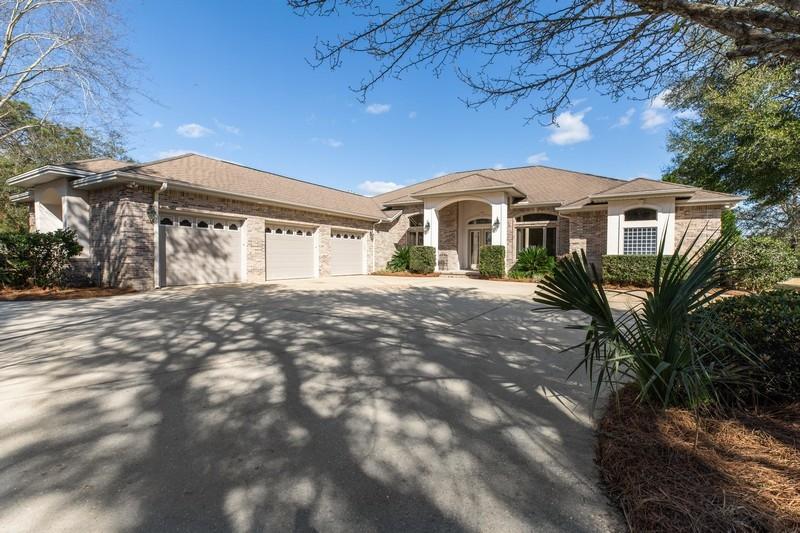 Golfer's delight! You will love the curb appeal of this beautiful 4 br, 3 ba, 3,832 sq ft executive home stately situated on a large .65 acre level lot. You will find that this brick custom home is not your typical cookie cutter home. The owner was in the business and managed every detail of the construction, personally choosing the materials and subcontractors. Upon entering, you may wonder why the home feels so impressive. Maybe the grandeur of this home stems from the fact it was built on a bigger scale, with finer details than you normally see. For example, the 12+ foot ceilings, eight foot doors, and extensive trim work all add to the striking appearance, ambiance and vibe of the home. The home has been freshly painted and has new carpeting.(see additional information)