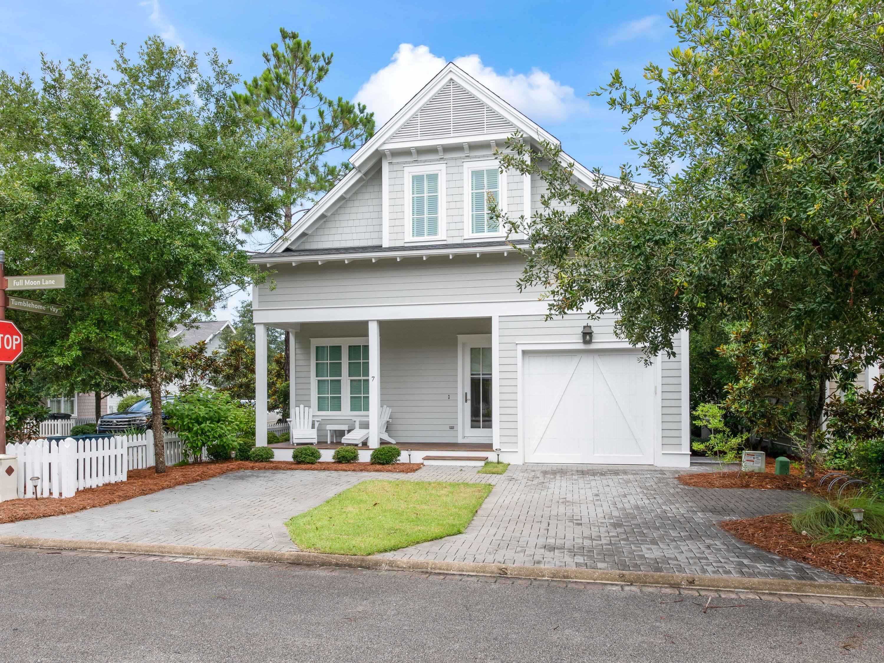 Welcome to 7 Full Moon Lane in the coveted, gated, community of Watersound West Beach located on the south side of 30A.  Favored by primary homeowners, vacation home residents as well as renters that return year after year, this home will satisfy any of the above. It is located at the end of a boardwalk that provides privacy on its screened porch from homes across the boardwalk.  Fully furnished, it is a turn-key property with four bedrooms including a primary on the first floor as well as a larger primary with five piece bath on the second floor.  A separate living area on the second floor can easily be converted to a bunkroom that has access to a hall bath.  Just a short stroll or bike ride will take you to the large community pool and the scenic walk-over to the quiet, spacious beach.