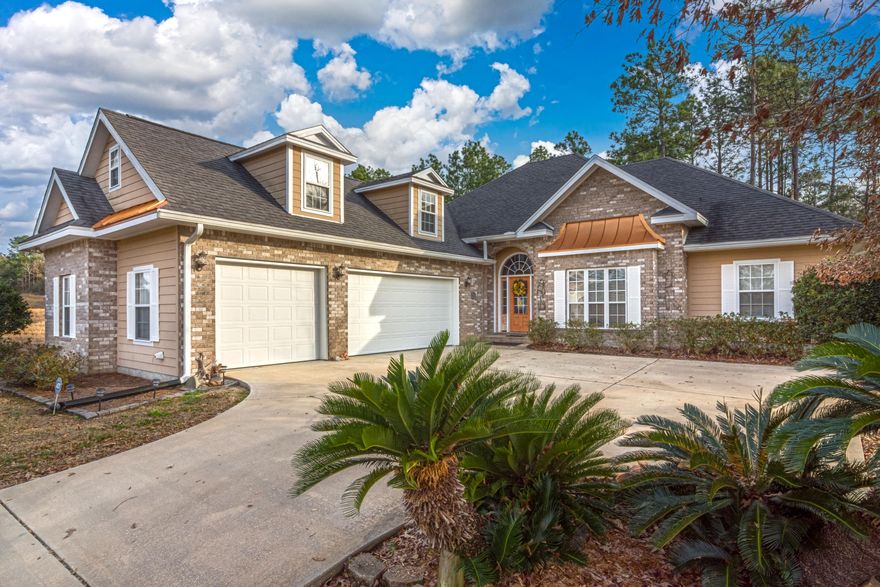 BACK ON MARKET at no fault of the seller! Beautiful stately 3 bd/2 ba home situated on a large .38 acre lot in Heritage Plantation. The brick/hardi exterior is complimented nicely by copper metal accents and has a three car side entry garage. Inside features a semi-open floor plan. Living room boasts a wood-burning fireplace, kitchen w/ granite countertops, breakfast bar and an eat-in breakfast area. Formal dining room near kitchen as well. Spacious master suite w/ double trey ceiling and nook great for an office or sitting area. Split bedroom design with guest bedrooms on opposite side of home. Upstairs is a HUGE bonus room/flex space. Enjoy the rear screened-in porch! Schedule your appointment to see this beautiful home today! Buyer to verify all areas of importance for themselves!