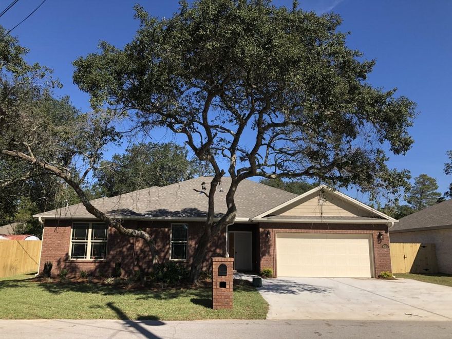 BEAUTIFUL CUSTOM ALL BRICK 4 BEDROOM 2 BATH HOME WITH 9 & 10 FOOT CEILINGS AND LOADED WITH AMENITIES. You will love this Very Open floor plan with a large Family room with reverse tray ceiling and rope lighting which gives a very elegant look in the evenings. If you like entertaining then this floor plan is for you!! The kitchen boast granite countertops with a high top breakfast bar with a USB outlet, custom cabinets, a custom back splash, pantry, upgraded stainless steel appliances including a refrigerator with ice maker. The large master bedroom has a beautiful reverse tray ceiling with rope lighting as well. Upgraded lighting fixtures and mirrors throughout the home along with crown molding in