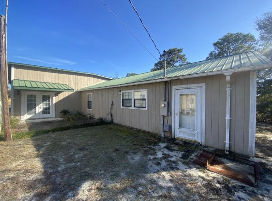 Entered for comp purposes. Home was built on site (normal frame construction) and later they built on an addition with a living room, bathroom, and garage.  Mobile home in front of the house is being removed prior to closing.