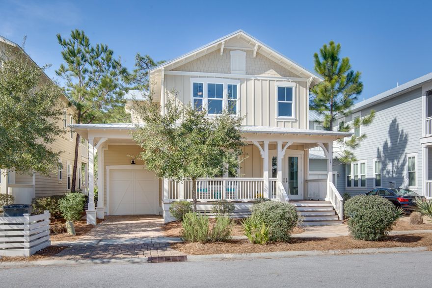 Beargrass is a special street in NatureWalk with just 20 homes and near the front of the community and the beautiful wooden bridge.  25 Beargrass backs up to Point Washington State Forest- where you can enjoy views of wildlife, the peace and tranquility of the pine trees and sunsets peeking through in the evenings. This Wind Chime floor plan has all the extra's including a porte cochere and comes furnished! Walk into the open foyer, past a 1st floor bedroom into the wide open dining, family room and kitchen overlooking the forest. Living room features a cozy fireplace and stained beams with ship lap on the ceiling and partially up the walls.