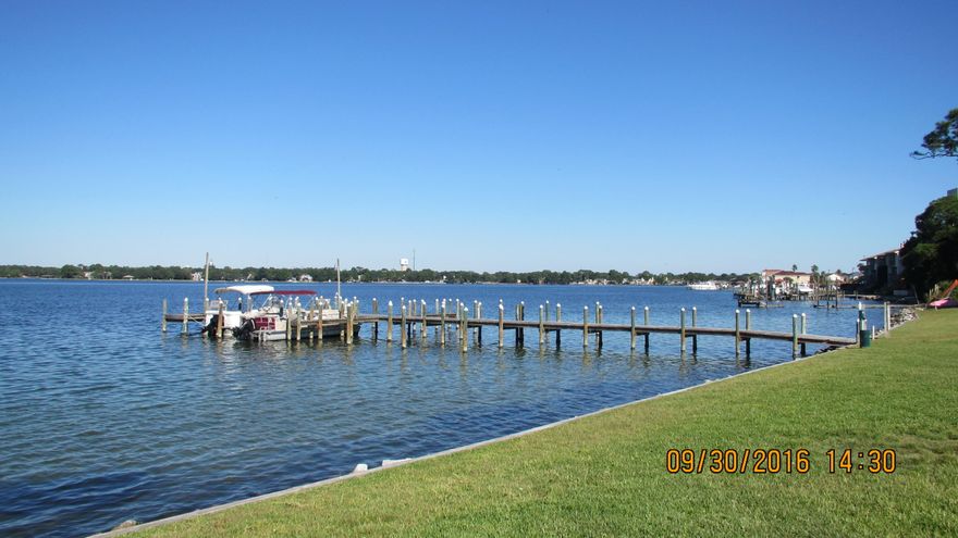 2 bedroom, 2 bathroom waterfront unit that has a washer/dryer in the unit. Watch the sunrise from your living room or master bedroom every morning. There is a community pool and dock to enjoy as well. Water, sewer, trash and basic cable is included in the rent.
