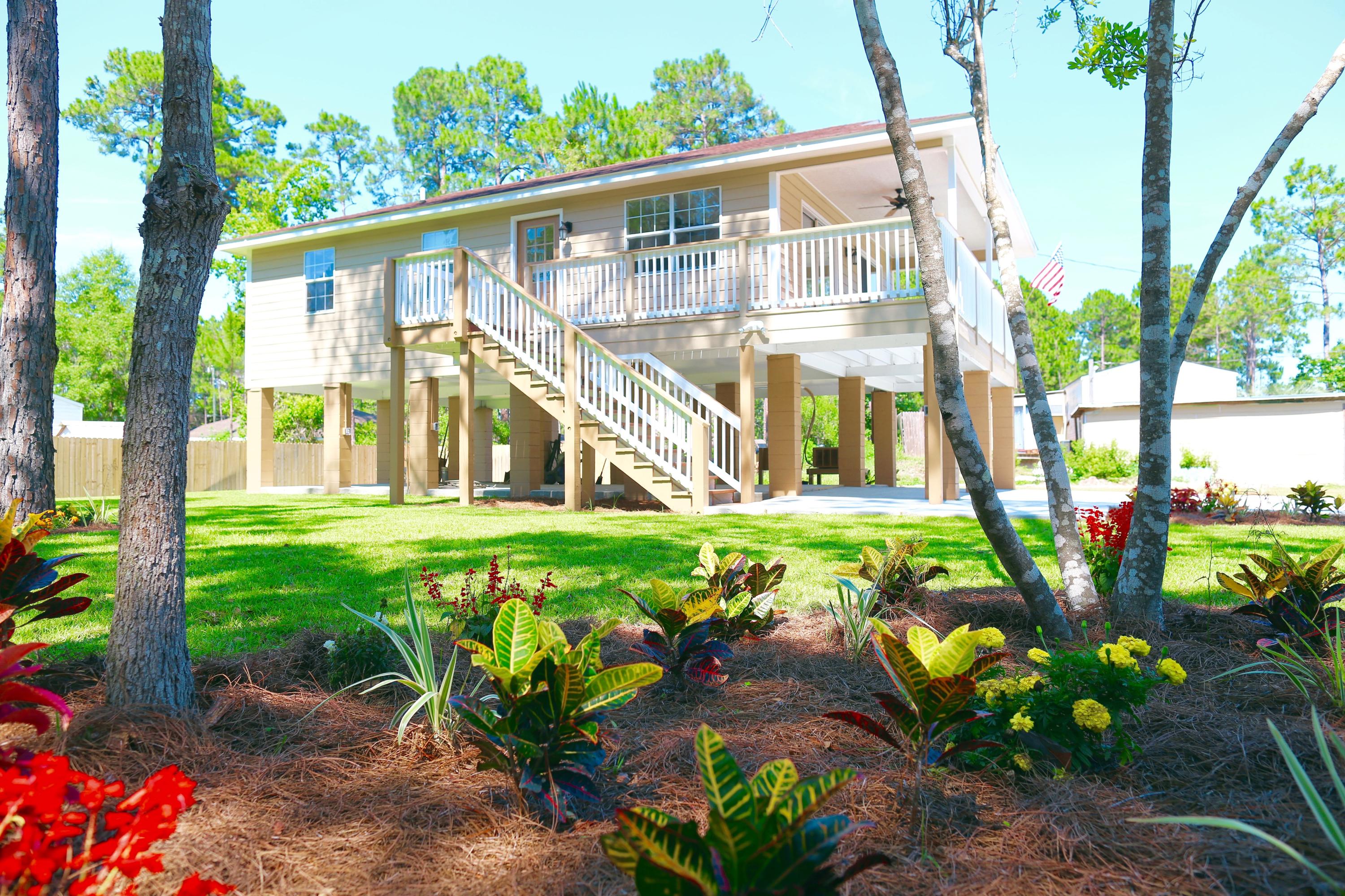 Updated and Upgraded! All new inside and property is immaculate. Yard is replaced with new sod and plants. Great deck overlooking property and covered area below home for entertaining or build a workshop or expand the home.