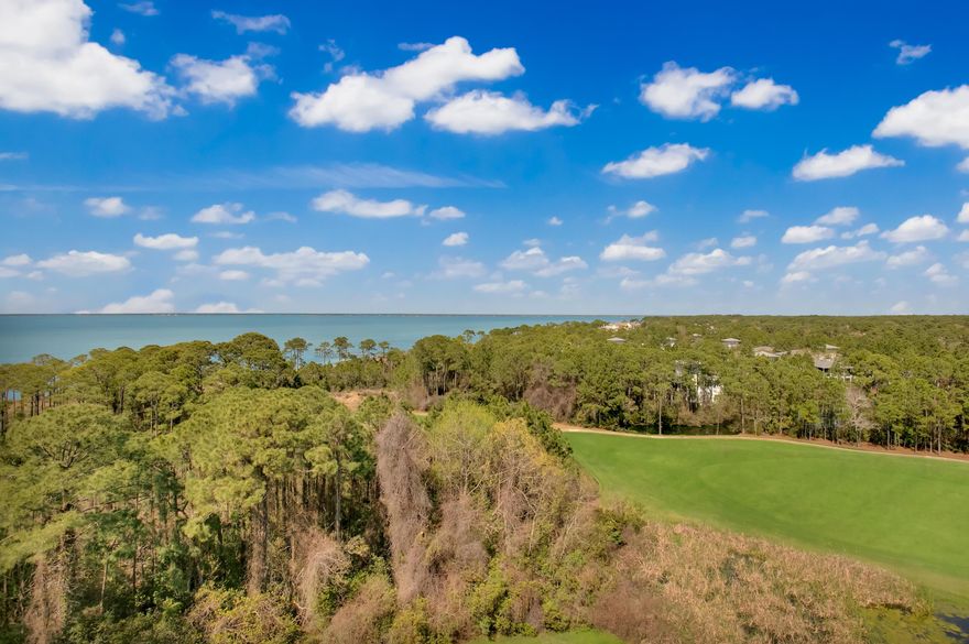 Top floor resort condo with 3 balconies to take in the spectacular Northwestern views of the Choctawhatchee Bay, natural wetlands, and the 17th fairway of Burnt Pine Golf Course. Pristine travertine tile flows throughout for a low maintenance upkeep. The lock-off floorplan offers maximum rental capabilities: It can be rented as a Studio, 1 bedroom, or as a full 2 bedroom unit. You could even keep one side personally and rent out the other. The opportunities are endless! Prime location in the heart of the Grand Complex within The Village of Baytowne Wharf, a pedestrian scenery with shops, dining, playground, live music and more.