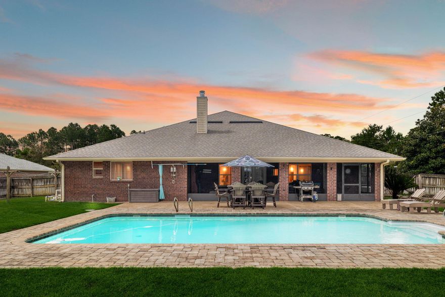 Welcome to 7522 Treasure Street -- a stunning, custom-crafted home that brings luxury, comfort, and functionality together on Florida's beautiful Gulf Coast. Nestled in the sought-after Holley by the Sea community of Navarre, this spacious 4-bedroom, 2.5-bath residence offers the best of indoor and outdoor living with a thoughtful blend of recent renovations and practical enhancements. Sitting on a generous half-acre lot, the property is truly turn-key and move-in ready for those seeking refined Southern living. As you step inside, you're immediately greeted by the elegance and warmth of the home's open-concept layout, ideal for both family life and entertaining. The heart of the home is undoubtedly the newly remodeled kitchen, a dream come true for any home chef or culinary enthusiast. Outfitted with custom cabinetry, sleek quartz countertops, and top-of-the-line stainless steel appliances, this space is designed for functionality and style. A spacious center island offers plenty of prep space and seating, while the soft-close drawers and modern lighting create an inviting ambiance that extends naturally into the adjacent dining and living areas.

The cozy living room centers around a beautiful gas fireplace, creating a warm and relaxing space to gather, especially on cooler Florida evenings. New flooring throughout much of the home complements the light-filled rooms, while the upgraded bathrooms all recently remodeled showcase contemporary fixtures, tiled showers, and luxurious vanities that elevate everyday routines into spa-like experiences.

When it comes to comfort and efficiency, 7522 Treasure Street is second to none. The home features a brand-new AC unit installed just 6 months ago, ensuring year-round climate control. Additionally, you'll never run out of hot water thanks to two tankless water heaters one electric and one gas, a rare and incredibly efficient feature that offers flexibility for larger households. And in the event of a power outage, the whole-house generator provides uninterrupted peace of mind, keeping all your essential systems running without a hitch.

Outdoors, the home continues to impress. Step into the screened-in back porch, perfect for bug-free relaxation on breezy afternoons or evening dinners under the stars. Beyond that, the custom fire pit area invites you to unwind, roast marshmallows, or enjoy time with friends and family under the open sky. A fully installed sprinkler system with its own dedicated well keeps the lush lawn green year-round without adding to your water bill a smart and sustainable touch.

For hobbyists, collectors, or anyone who enjoys having extra space to create, this property delivers in a big way. The detached man cave garage at the back of the property is an absolute standout. Whether you're into woodworking, car restoration, gaming, or just need a quiet retreat, this space is ready to serve. 

In addition to the detached garage, a dedicated tool shed provides extra storage for gardening tools, outdoor equipment, or seasonal decorations. Every inch of the property has been considered for both beauty and functionality.

Parking is plentiful with a large driveway and attached two-car garage, ensuring there's room for guests, boats, or recreational vehicles. The property is located within the Holley by the Sea HOA, granting access to top-tier amenities like pools, tennis courts, pickleball courts, a fitness center, access to docks, campgrounds, and private beach access all for a low annual fee.

Set in one of Navarre's most desirable communities, you're just minutes from pristine Gulf beaches, A-rated schools, and local dining, while still enjoying the quiet peace of a residential neighborhood.