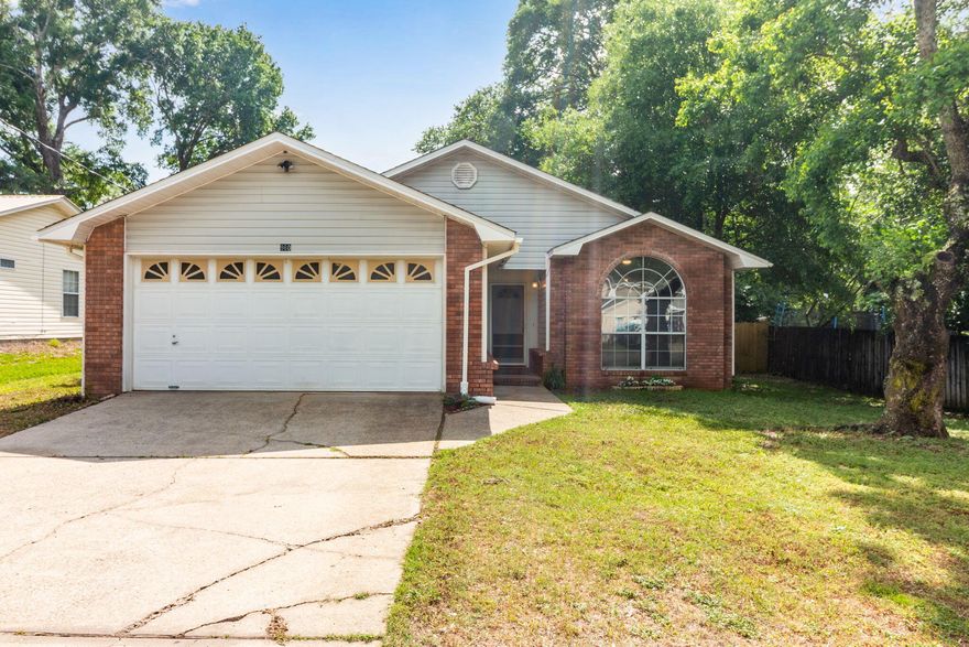 Welcome to your beautifully updated North Crestview home--perfectly ready for summer cookouts and backyard gatherings. Inside, you'll find wood laminate and tile flooring throughout, vaulted ceilings, fresh paint, and stylish barn doors that add character. The newly renovated kitchen features stainless steel appliances and plenty of space to cook and entertain. Enjoy the enclosed patio year-round and a spacious, fully fenced backyard with two large storage sheds. A move-in ready home offering comfort, charm, and functionality.