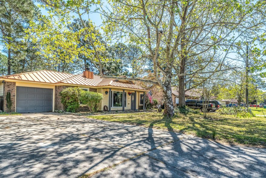 Fall in love with this tres chic Florida cottage from the moment you pull in the driveway. The copper-colored metal roof not only provides low maintenance but also adds a touch of class to this affordable home. If you have been looking for an art studio, gym, man cave or she-shed, then you do not need to look any further! There is an adorable A/C cooled studio building out back as well as the single car garage that is heated and cooled (not included in sq. footage). Windows were replaced prior to the current owners purchase so they are fairly new, which means savings on your energy bills! The kitchen is appointed with a commercial grade six burner range with dual fuel oven, a Bosch dishwaser and brand new Frigidaire Gallery refridgerator. Water heater was just replaced a (con't)