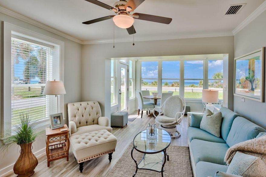 Located on a large corner lot, this Bid-a-wee beach retreat offers picturesque views of the Gulf of Mexico and includes community deeded beach access. Providing 2,567 sq. ft of living space, the residence includes a main house, as well as a guest cottage. Completely refurbished in 2017, the main house features luxury vinyl flooring in the main living areas, three bedrooms, 2 full baths, a screened-in porch and sun-room that overlooks the gulf, a chef's kitchen with custom cabinetry, granite counter-tops, and stainless steel appliances. The coastal-themed carriage house offers two additional bedrooms, 2 full baths, a full kitchen, living and dining area with hardwood flooring in the main living areas, 10 ft ceilings, and a wraparound porch with gulf views