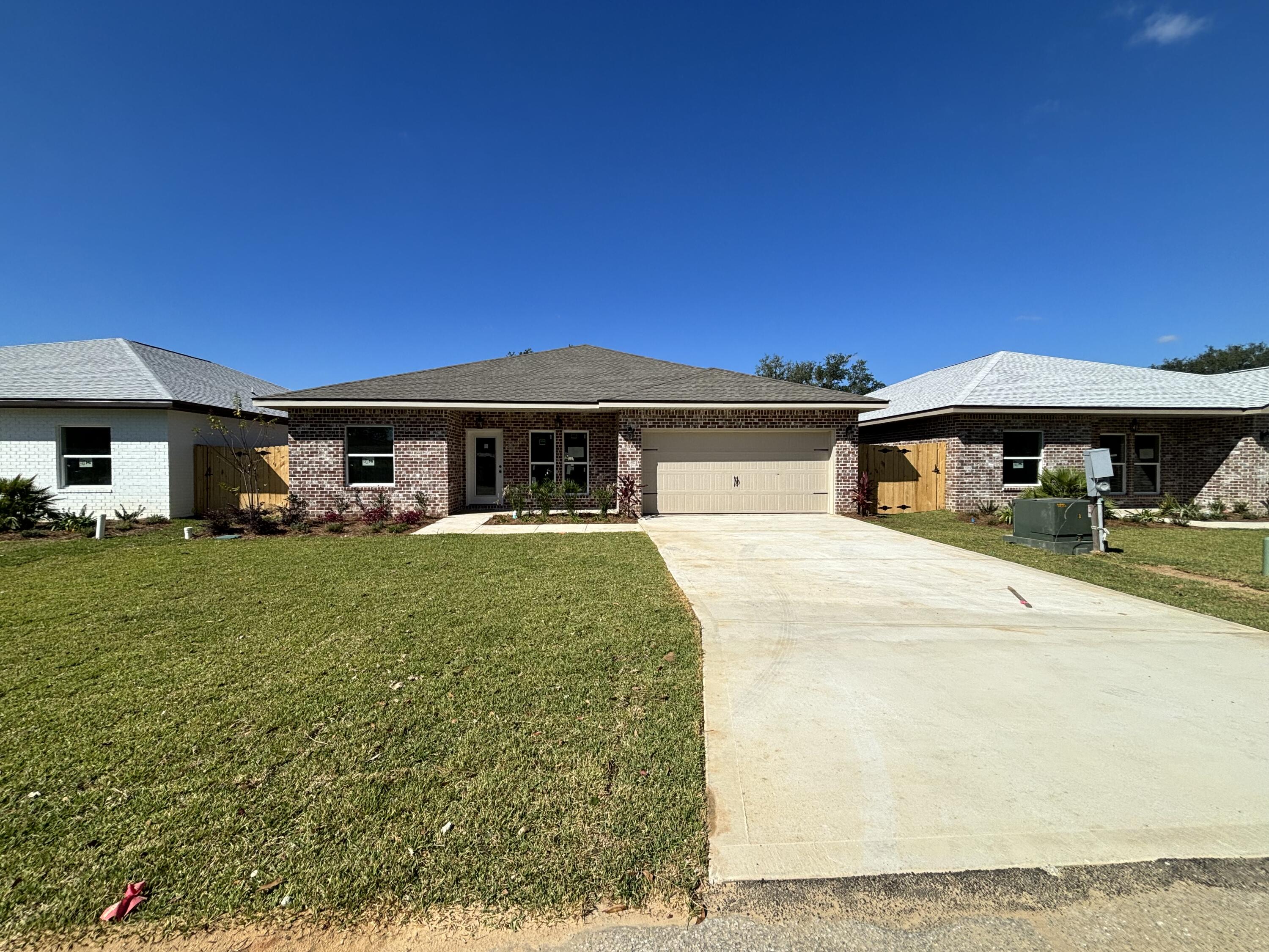 Seller paying up to $10,000 in buyer closing costs with use of preferred lender. New construction in the heart of Shalimar. 4BR/3BA, 2CG custom brick homesite has 9 Ft. ceilings w/ impressive crown molding, LVP flooring throughout most of the home, tile in the master bath, and 5 1/4'' baseboard throughout. Kitchen boasts custom painted white cabinetry, granite countertops, a large pantry, and stainless appliances. Master suite is in the right rear of the home, is very roomy, has 2 large walk - in closets, a marble walk - in shower with glass enclosure, a whirlpool garden tub and double vanity. The great room is located at the rear of the kitchen and opens to a covered porch, which is perfect for entertaining. The yard will be beautifully landscaped, will have a privacy fence, and comes complete w/ a sprinkler system, well and timer. Insurance will be very reasonable, as home is built to today's code. Fabric Shield hurricane protection is included for the owner's piece of mind. Completion is expected in late November of 2023.