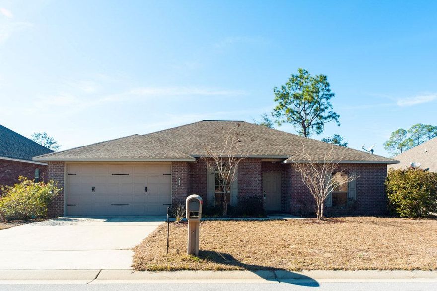 Plush home in refined Duggan Pond Estates south of I-10! Features open floor plan and rich, dark wood laminate floors. The stylish kitchen has granite counters, track lighting, upgraded sink and even a wine refrigerator. It's open to the living and dining room for a spacious feel. You'll love the master bath with an impressive granite walk-in shower with rain head. All bathrooms have granite counters. Fresh colors add to the contemporary feel. Lovely fenced back yard. Great location for easy commute to Eglin AFB and Destin Beaches close by - especially with the new Mid-Bay Bridge connector!