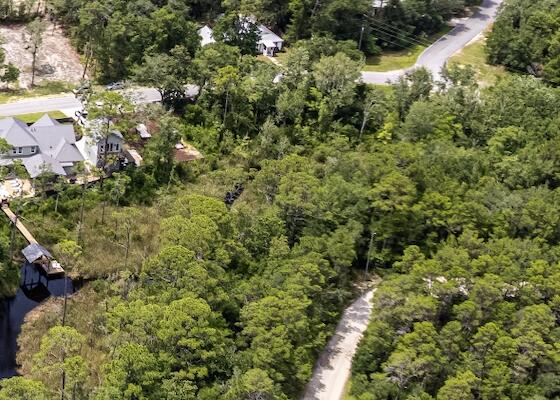 This jet ski-accessible canal-front lot offers direct access to the Bay and Intracoastal Waterway, and comes with a fully approved seawall already constructed and ready for your custom home build!Tucked away in the quiet, historic community of Point Washington, you'll enjoy a peaceful, natural setting while being just minutes from the energy of Scenic Highway 30A.Spend your days exploring 30A's world-renowned beaches, dining, shopping, and entertainment, then return home to the serenity of your private canal-front retreat.Don't miss this rare opportunity to build your dream home in a location that offers both access and escape.