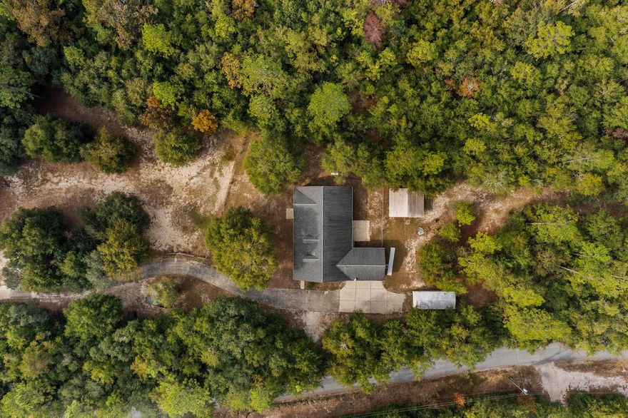 Coming Soon with Professional Photography.Such a rare piece of property! 7 acres with a creek. Three Bedrooms, 2 baths, covered front and back porches. New roof in 2022.