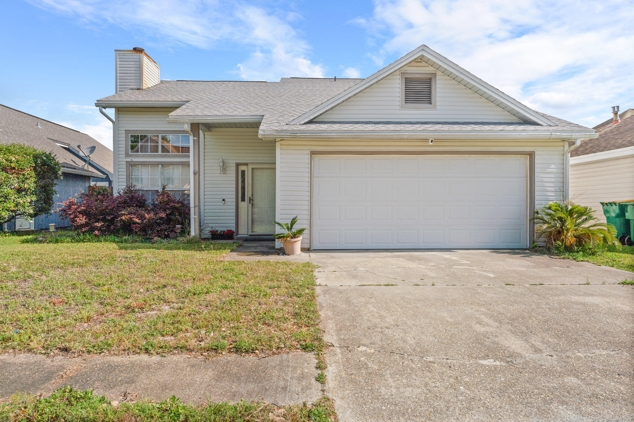 LOCATION! LOCATION! 2021 ROOF and 2022 HVAC! Minutes to Hurlburt AFB! Spacious home! As soon as you come in you will notice the beautiful wood laminate floors, vaulted ceilings, and cozy wood-burning fireplace. The open living and dining space is perfect for any family. The kitchen features lots of natural light, a breakfast bar, and stainless-steel appliances. The primary bedroom and bath are downstairs, and an additional two bedrooms and full bath upstairs. The French doors off the dining lead to the screened-in patio and fenced-in backyard. Don't miss out on this charming home!
