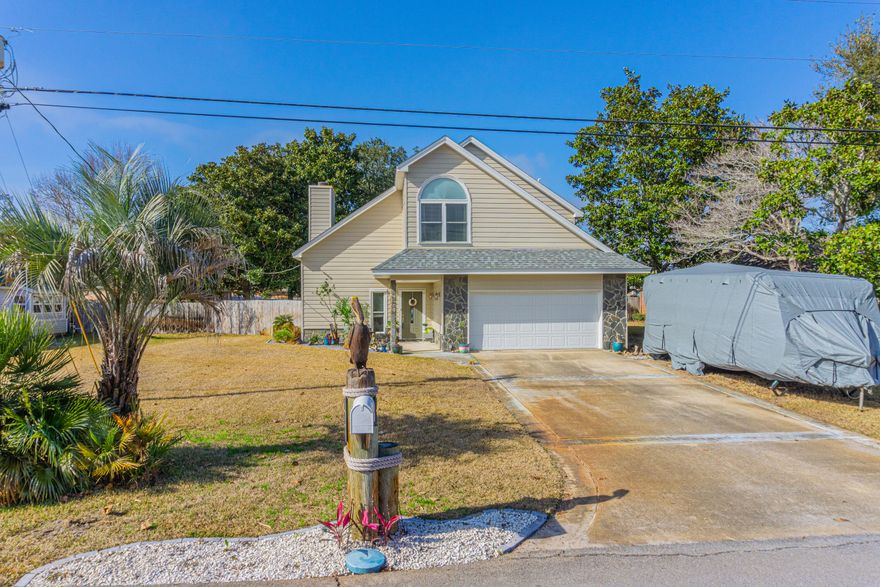 Lovingly maintained and move in ready! Tranquil Soundside Neighborhood with Beach Access! Skylights flood the interior with natural light as you enter into the foyer. Step down into the living room graced with a floor to ceiling stone fireplace. Take a slight step up into the dining area which flows to the eat in kitchen. Lots of Cabinets and plenty of counter space!  Upstairs you walk along an open balcony walkway to access the 3 bedrooms. The master has peek-a-boo views of the sound. Upgrades done by this seller include: new Roof 2020Siding (Composite) 2021, A/C Unit 2019Generac 2021, Yard building built on a slab with solar lighting and ventilation. The backyard is HUGE and privacy fenced. This Home is in an X flood zone! The HOA is voluntary and includes water access. Per the Seller----

Roof 2020
Siding (Composite) 2021
A/C Unit 2019
Generac 2021
Wind Mitigation Cert
Zone X
Upgraded Irrigation Pump 2024
Premium Quality Appliances Fridgeaire Gallery (oven even has an airfryer built in) 2022 (Fridge 2024)
Transfersble Home Warranty
Shed with concrete flooring and built-in shelves 2024
Annual Termite Inspection
Voluntarily HOA. $$225 annual fee. Community Beach (HOA).