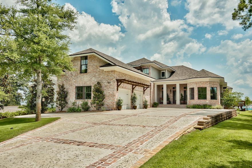 Discover one of Destin's most exquisite custom built homes that has been decorated to perfection. With stunning architectural details throughout, this gracious 5 bedroom, 6 bathroom waterfront home is situated in a gated community boasting expansive views. The spacious and open floor plan includes high ceilings, separate dining room, breakfast nook and great room, ideal for entertaining. The heart of the home is the chef's kitchen, with Thermador kitchen appliances, large kitchen island and butler's pantry. The waterfront master retreat has a gas fireplace and ensuite master bath with steam shower and custom walk in closet. Step outside to enjoy the backyard oasis which includes a saltwater pool with hot tub, sun tanning ledge, and dock with two boat lifts.