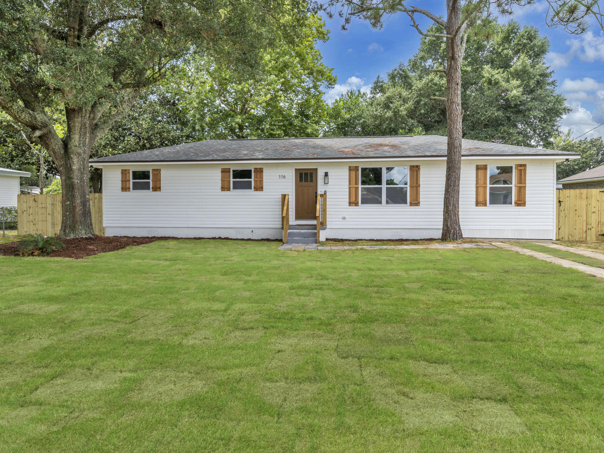 This completely renovated 1,280 sq ft, 3 bedroom, 2 bath home is brimming with charm and modern upgrades from the moment you step inside. Every detail has been refreshed, including new luxury vinyl plank flooring, fresh interior and exterior siding, updated lighting and fixtures, and stunning finishes throughout.The bright, open kitchen features solid wood soft-close cabinets, quartz countertops, stainless steel appliances, a subway tile backsplash, and an oversized stainless steel sink overlooking the spacious backyard. The master suite offers a private, spa-like retreat with a brand-new shower insert, heirloom double vanity, updated fixtures, and modern finishes. The second bath is equally impressive with a new tub, flooring, vanity, and lighting. Major system upgrades provide peace of mind, including a brand new roof (2025), new vinyl siding, new windows, new exterior doors and shutters, new deck, new electrical panels with a full home rewire (2025), new hot water heater (2025), new HVAC system and ductwork (2025), and new insulation (2025).
Two large storage sheds on concrete foundations offer plenty of space for tools, equipment, or recreational gear. With no rental restrictions, short-term rentals are allowed, making this a versatile investment or personal residence.
Perfectly located in the heart of Fort Walton Beach, this home is just 6 miles from Hurlburt Field, 1.5 miles from the white sand beaches of Okaloosa Island, and less than a mile from the shops, dining, and entertainment of Downtown Fort Walton Beach. Move right in and enjoy a worry-free, coastal lifestyle.