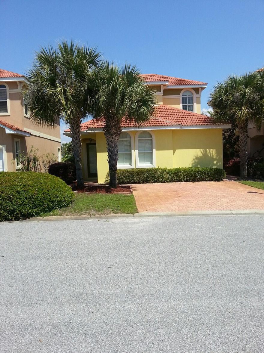 Gorgeous home inside and out with great curb appeal. The exterior features a brick paver driveway, outside storage, beautiful landscaping with outdoor lighting and a courtyard style back patio. The interior features 10 foot ceilings throughout, crown molding, stainless steel appliances, granite countertops and plantation shutters. The HVAC and dishwasher are new. The master bedroom suite is located downstairs with a spacious master bath with double vanities, separate shower, whirlpool tub and a large walk-in closet. Both bedrooms upstairs have new carpet, and access to a balcony on the back of the house. This home has been pre-wired for surround sound. Pest control is built in the walls of the entire home and is accessed from the outside of the home. Calusa Bay has a