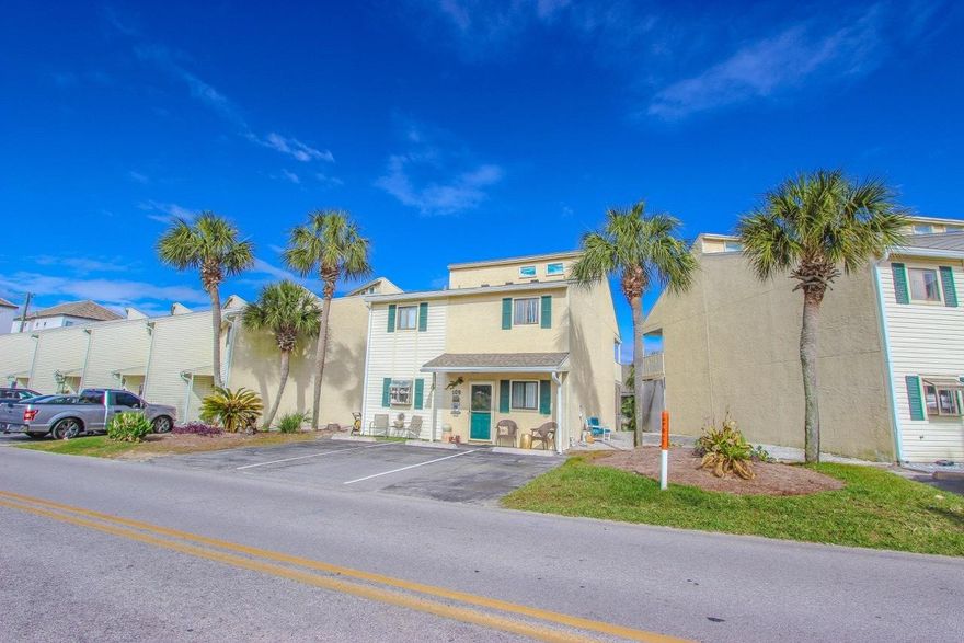 The open concept main level features a large living area, formal dining area, and kitchen with a breakfast bar. The half bathroom is located on the main level, as well as a full-sized laundry room & storage area under the stairs.Step onto the screened porch, and now you are just steps away from the beautifully renovated community pool.Head upstairs and enter the spacious master bedroom. With vaulted ceilings, private master bathroom and inviting, oversized balcony makes it your private sanctuary. The two additional bedrooms share a full bathroom.A new roof was added to the complex in 2015 and brand new a/c in 2020!This property has parking for 3 vehicles. Misty Cove is where your beach dreams begin!