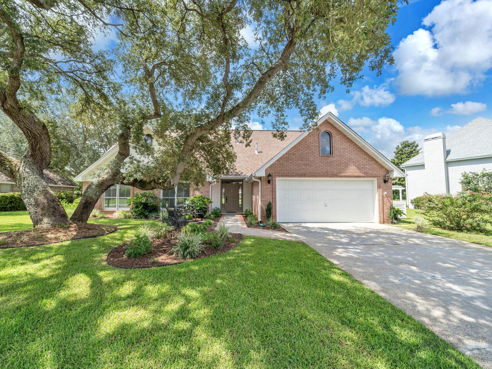 Stunning 4 bedroom and 3 bath home with 3290 sq ft located in the desirable Shalimar Pointe Gated community! This home is located on the 18th Fairway of the Shalimar Pointe Golf Course! Shalimar Pointe is a waterfront, golf course and tennis community! Eglin and Hurlburt Airforce bases and white sandy beaches are a short drive! This home features a whole house generator (Generac)! Enter this home and notice the raised ceilings (20ft) and crown! The foyer opens to the grand living room and the office and features a custom mosaic tiled floor! The living room features built in book cases, a gas fireplace with a mantel, tiled surround, floor electrical sockets for lighting, and three large sliding glass doors opening to the extended patio and golf course. Gorgeous, hand scraped wood laminate flooring is in the living room, foyer, office and dining room. The home features updated lighting to include: chandeliers, pendant, recessed, and ceiling fans. The formal dining room area is large enough for a table that seats 12 and also boasts a view of the golf course and is perfect for entertaining. Enter the chef's kitchen and notice the custom cabinetry with crown, granite countertops, undermount sink, brushed nickel faucets and hardware. There is a center island with a raised bar that seats 4. The kitchen backsplash is travertine tile. The appliances include a slide in stainless and black gas stove, built in microwave, a beverage fridge and a side by side stainless refrigerator with icemaker. There is a bonus room with French Doors off the foyer and this room has vaulted ceilings, large windows with plantation shutters, and a transom! The primary bedroom is on the first floor and is very large! The bedroom overlooks the stunning views of the golf course and has a open patio. The primary bathroom has a large double vanity, wall to wall mirrors, vanity lights, soaking tub, and walk in shower. There is cultured marble, black shower trim and hardware to add a modern touch. There is also a separate water closet. Finally, the primary bathroom has a large walk in closet with shelving! Upstairs there are three additional bedrooms, a full bath and a large landing area! Both of the guests bathrooms have nice sized vanities, updated hardware, tub and shower combinations with cultured marble! There is a nice sized laundry room with built in cabinetry and large front loaders and a sink basin. The exterior of the home has a large, double patio that is perfect for entertaining guests! Drink a coup of coffee and enjoy the gorgeous, Florida weather overlooking the golf course! There is a 2 car garage with built in cabinets, gutters, mature vegetation, and extra room in the driveway for parking. This community has the Shalimar Pointe Golf Club, the Shalimar Tennis Club, and is a gated community! Buyer to verify all dimensions and information.