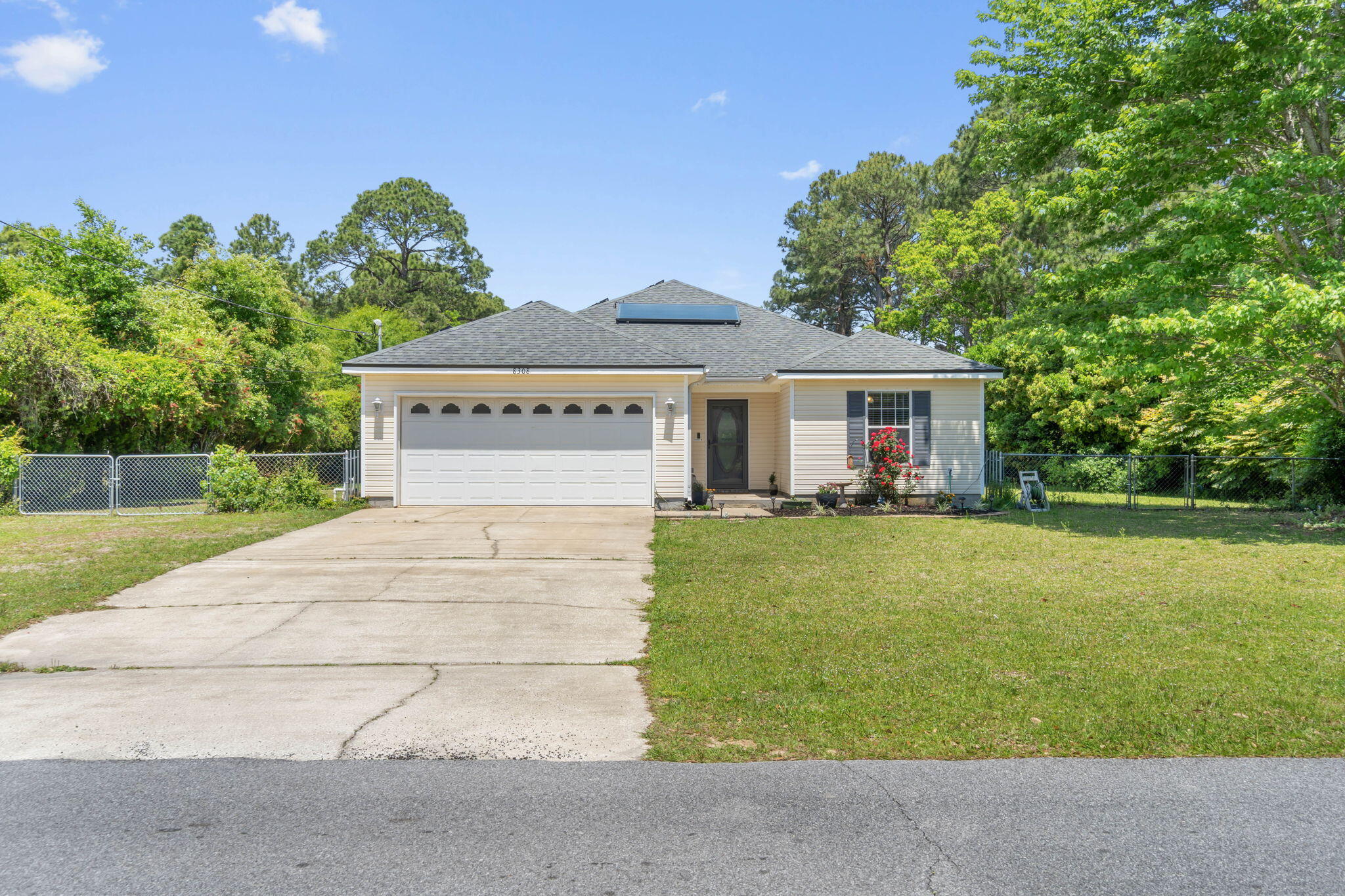 Charming home in a prime location, just moments from pristine beaches, shopping & restaurants. This delightful property boasts a newer roof and energy-efficient solar panels, fully paid off at closing, guaranteeing minimal utility costs between $30 to $40 per month. Enjoy eco-friendly amenities including a solar water heater and an updated HVAC system installed in 2018. The interior features new luxury vinyl plank flooring added in 2020 & newer appliances from 2023, along with freshly paint. A spacious two-car garage and a large master suite with a dual-vanity bathroom, water closet, and expansive walk-in closet add to the home's appeal. Set on a half-acre lot, the residence offers a fenced backyard with sprinkler system & screened patio, perfect for relaxing and entertaining.