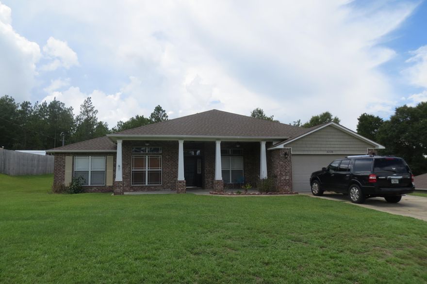 This great home sits on a very large yard with a great backyard. Walk up to a covered front porch that is great to sit out and watch your beautiful view. Walk inside to a large living area that has crown molding, fireplace and an open floor concept. Large bedrooms and master with 2 walk in closets. Master also has an elegant garden tub. Kitchen has granite countertops, island, all stainless steel appliances. There is also a great covered patio area out the back door to have more room for enjoyment or entertaining. This home also backs up to a natural area and no back yard neighbors. This home was also built with upgraded lighting package. Great home and must see. Interior pictures unable to obtain due to packing getting ready for the big move. Yard large enough to add RV or boat parking.