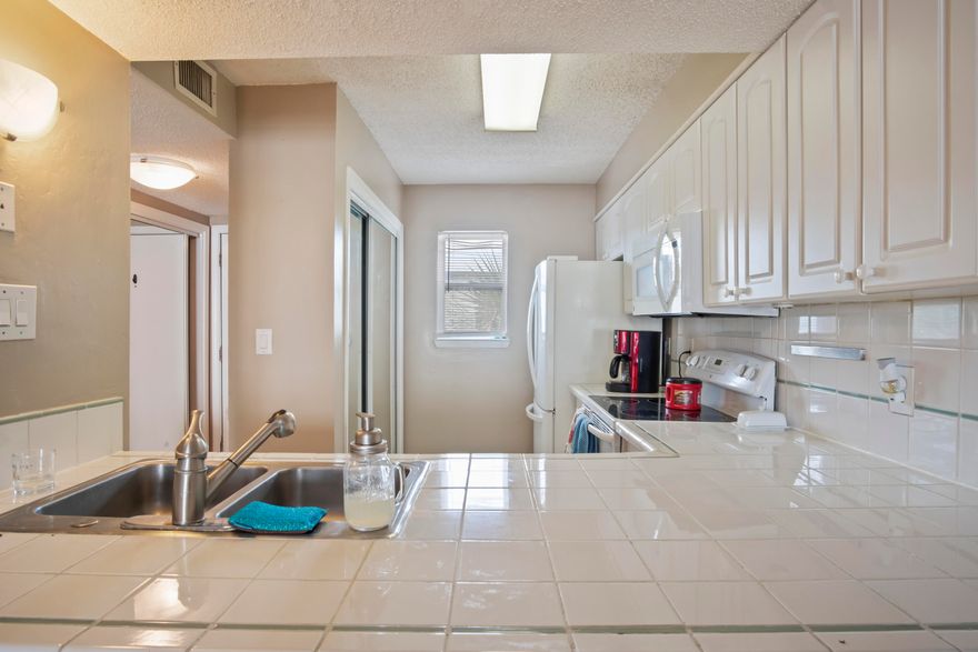 Beach life at an affordable price! This unit offers an open layout with tile flooring throughout, sliding glass doors open to your private balcony, accessible kitchen with breakfast bar, in unit laundry, and a powder bathroom on first floor. Master bedroom suite, additional bedroom, and hall bathroom on second floor. It's just a short walk to the beach, restaurants, and shopping in downtown Ft. Walton Beach. Don't miss this opportunity to live island style in Islandwood!