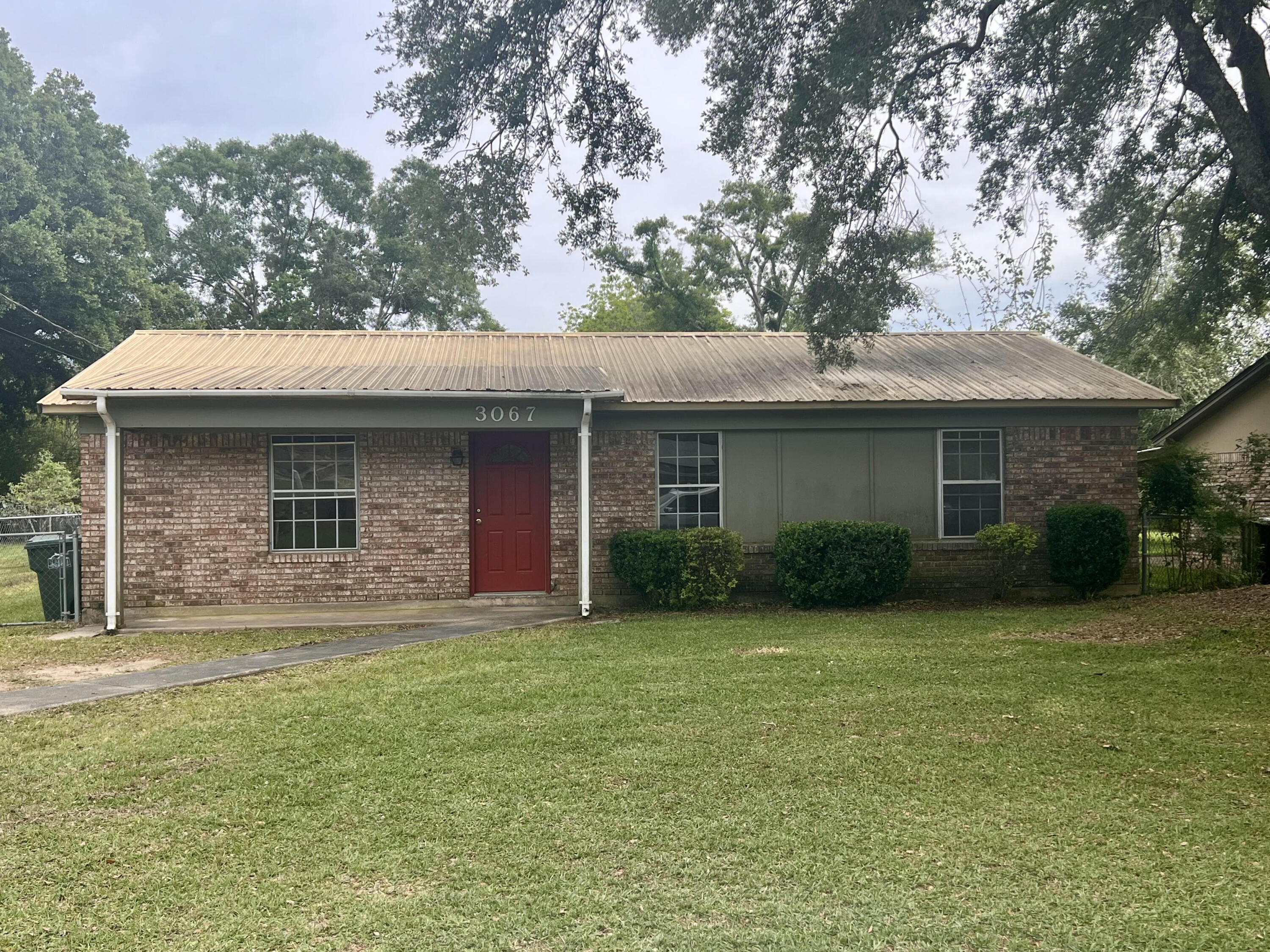 Quaint ranch style home with 3 bedrooms and 1.5 bathrooms. New laminate flooring throughout the home, new kitchen cabinets and countertops. The property includes a spacious fenced in back yard with a covered porch/carport in the back.