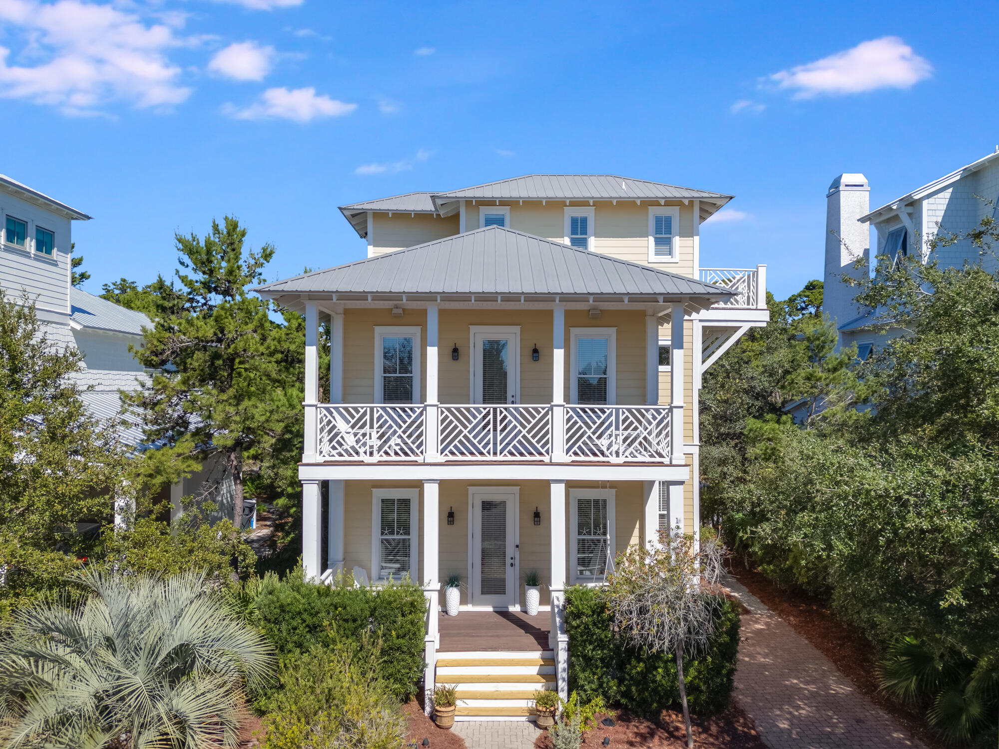 Here is your chance to live the 30A coastal life, in this fully furnished home in the Preserve of Grayton Beach. Situated on a spacious .14 acre lot, this 5 bedroom and 3 1/2 bathroom home is nearly 2600 feet inside, and has the additional natural privacy buffer of the Point Washington State Park in the backyard.  This home has never been rented and has been meticulously maintained inside and out. You will love the charm of all the oversized southern-style porches, perfect for your morning cup of coffee or an evening on the porch swing. This is coastal Florida living at its finest! On the main level, you will find an amazing living room and sitting space filled with natural lighting which helps accent the kitchen and dedicated dining room. There is also a full bedroom and full bathroom on this main level, perfect for the grandparents or in-laws. On the second floor, the private grand master bedroom awaits, with a walk-in closet, jacuzzi tub and separate tiled shower, and your own private covered porch. Down the hall are two more guest bedrooms and a hallway bath plus another private porch overlooking the yard and the state park. The third-floor bedroom is an ideal bunk space, with a kitchenette, separate closet, a half bath along with another private open porch on this level. The Preserve at Grayton Beach has private gated beach access, two community pools, tennis and pickleball areas and gated community entrances. Your family will love being so close to the beach, with the ability to enjoy the peace and tranquility of a charming coastal community. Rental projections range from $80K to $110K annually.