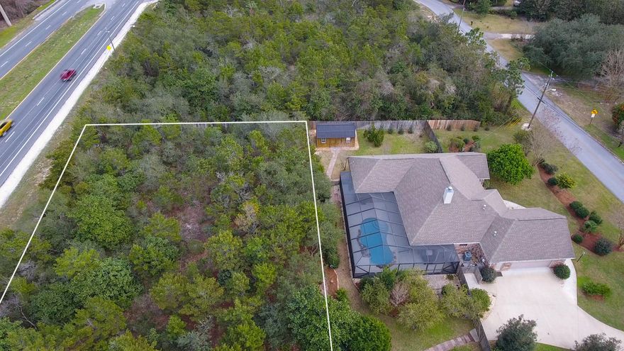 PRICE ADJUSTMENT! Large 0.4-acre residential lot in Emerald Pointe, a waterfront community on the intracoastal waterway of the Santa Rosa Sound, south of Hwy 98. Zoned for Single Family Home. This lot sits directly on Hwy 98 W with ingress/egress onto Hwy 98. Located in X Flood zone.Emerald Pointe voluntary HOA membership is $200 per year for private beach access off Shoreline Dr.All data and measurements to be verified by buyer.