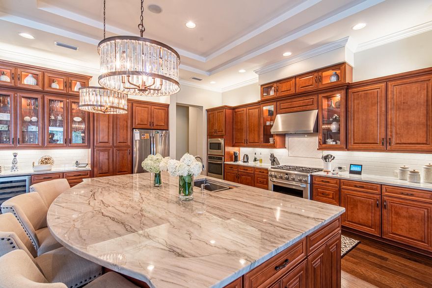 Nestled within the private gates of Kelly Plantation; overlooking the gorgeous golf course, resides a custom home built by Arthur Rutenberg. This newly listed home is meticulously maintained and thoughtfully designed, consisting of custom finishes and an expansive floor plan with high ceilings. The living area features a formal dining room and a massive kitchen island suited for entertainment with extra cabinetry space. This residence offers glass patio doors that open up to your private pool oasis with a vibrant summer kitchen and plenty of outdoor space making it the perfect extension of living space. Other notable features include: 3 zone central HVAC system, Culligan water softener system, 2 Rinai Tank-less Water heater and fully wired doors and windows for security.