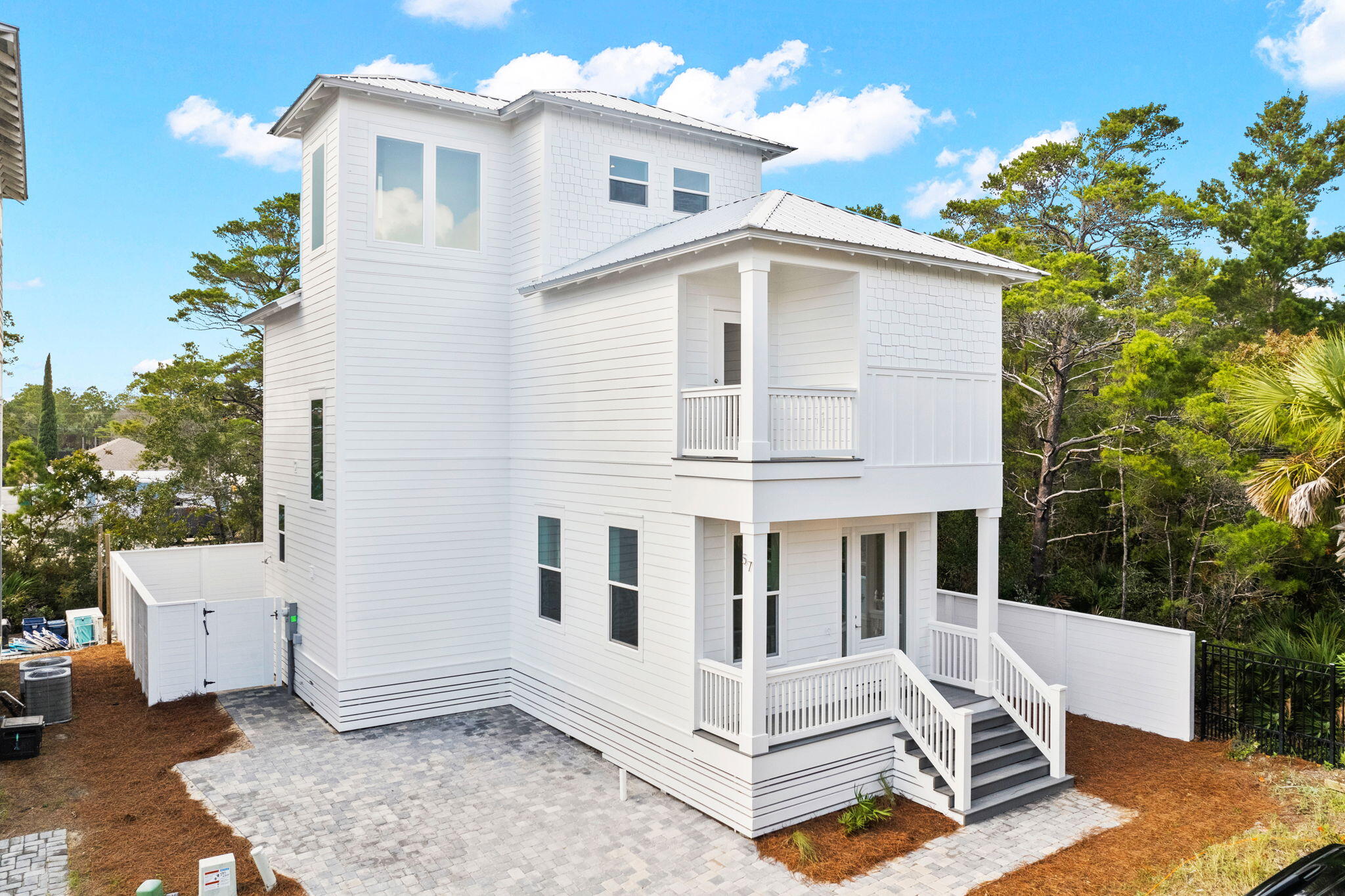 NEW CONSTRUCTION! This home is built to maximize rental income returns. Tucked away on a dead-end street with NO HOA DUES, you are just a short stroll away from the beach access and Gulf Place Town Center offering several restaurants and shopping venues. Three of the bedrooms will offer their own private full bath. The main level of the home will be geared around entertaining, with an open concept flowing from the living area through the kitchen, with access to the private pool area. There is a bonus space which could be used as a bunk room, along with a half bath on the main level. On the second level, you will find the master and two guest rooms, each offering a private full bath. On the 3rd level you will find another large bonus area, which could easily be
