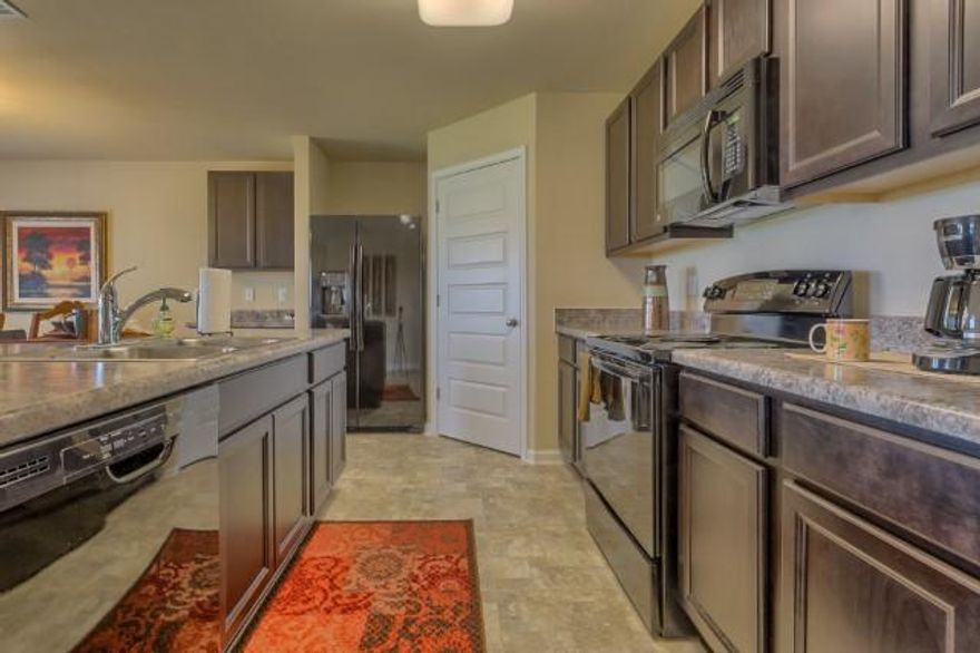 The Cali is a one story floor plan featuring 4 bedrooms, 2 baths, covered back porch & 2 car garage. The open kitchen features an island, stainless appliances and granite countertop. The kitchen opens to the great room w/ access to the covered porch. The master suite is just off the back side of the house & master bath features a separate shower, walk in closet, dual sinks & large soaking tub. Pictures, photographs, colors, features, and sizes are for illustration purposes only & will vary from the homes as built. Home & community information including pricing, included features, terms, availability and amenities are subject to change and prior sale at any time without notice or obligation.