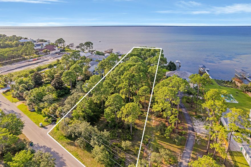 Primely positioned with 100' of frontage on Choctawhatchee Bay, this exceptional residential homesite offers expansive water views juxtaposed the coveted boating lifestyle that bay front living affords. The seller has reinforced this property with a vinyl seawall to ensure enjoyment of the pristine shoreline. This property boasts just over one acre of total footage generously proportioned with over 400' of depth to accommodate a sprawling coastal residence with excellent proximity to world class shopping, dining and local entertainment including the Sandestin Golf & Beach Resort as well as the Whole Foods at Destin Commons.