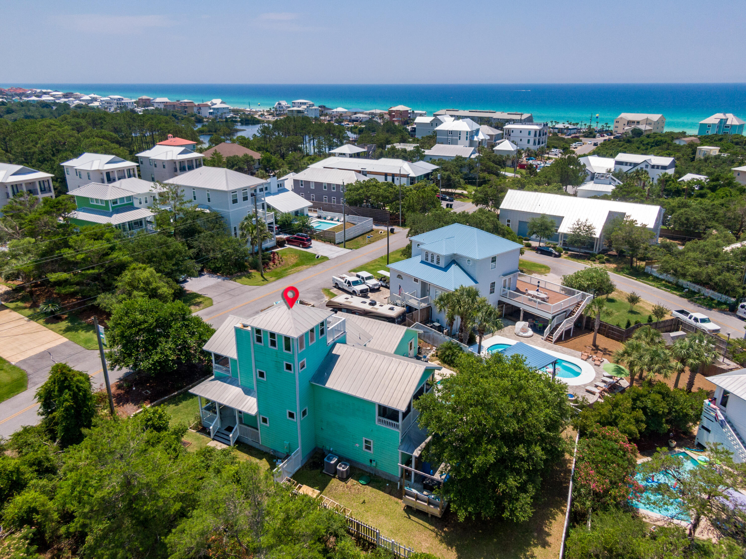 185 Hilltop Drive in Santa Rosa Beach, Florida is located just two blocks off of Scenic Highway 30-A with excellent beach access and tons of wonderful attractions nearby. This home sits on a generous lot with it's own private pool and features beautiful gulf views from the top deck! The house has 3 full bedrooms and 3 full bathrooms with a main floor living/kitchen/dining area and wraparound front porch. The 2nd floor affords the master bedroom and guest bedroom both with en-suite baths and their own private, screened in balcony. The 3rd floor 'lookout tower' has a nice area for sitting indoors or step out on to a good sized deck and feast your eyes on the gulf from this elevation nearly 60 feet above sea level.