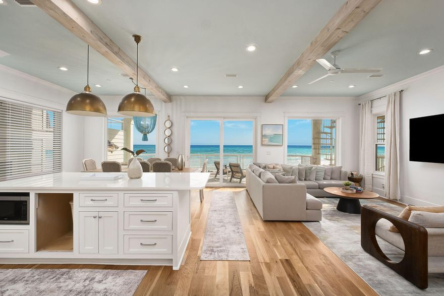 **Virtual Tour Available**20405 Front Beach Road is an exquisite gulf front home nestled perfectly in the Laguna Beach section of Panama City Beach. Boasting an ideal location for both vacation rental and personal enjoyment, it sits just five miles east of the luxurious Rosemary Beach and five miles west of Pier Park--the largest commercial and entertainment center in Northwest Florida. This residence presents an exceptional vacation rental opportunity with the sister home grossing annual rental income of $444,000 in 2024, and this home grossing just under $300,000 in a partial year on the same management program. The home has also never allowed pets, so the home's condition has been maintained at the highest caliber. 
Distinguished by its meticulously designed floor plan, 20405 Front Beach Road stands out amidst Panama City Beach properties. Unlike many coastal homes that prioritize sleeping space over functional living areas, this home features three distinct living room and entertainment spaces. With 10-foot ceilings and generously sized bedrooms, every occupant can relish in the tranquility of this gulf-front retreat. Outdoor amenities include expansive balconies on each level and a private pool overlooking the Gulf, surrounded by shaded seating areas. The property's design is inspired by the natural beauty of the coast, evident in its locally sourced hardwood flooring and serene color palette. Turquoise accents and white quartz countertops pay homage to the nearby beaches, creating a seamless connection between indoor elegance and outdoor splendor. 20405 Front Beach Road epitomizes the fusion of style and functionality, enhanced by its prime location amidst the best offerings of Northwest Florida. 
