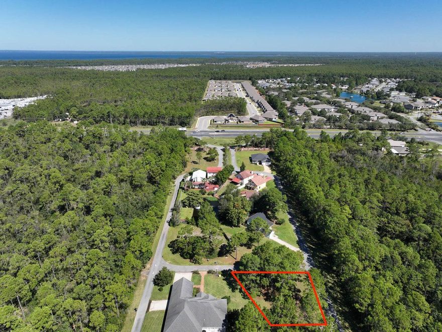 Imagine waking up to breathtaking views in Smugglers Cove, an exclusive waterfront community along the pristine Santa Rosa Sound. This prime corner lot is thoughtfully positioned to provide both peaceful seclusion and effortless access to the water, backing up to a tranquil pond--a perfect retreat for relaxation. Whether you're launching your boat from the private community ramp, enjoying a quiet afternoon of fishing from the dock, or cruising in the Sound at sunset, this location offers unparalleled coastal living. Indulge in resort-style amenities, including a pool and tennis courts, all while benefiting from an exceptionally low HOA. Best of all, this property sits in an X flood zone, meaning no flood insurance is required, giving you significant long-term savings and peace of mind. Whether you're dreaming of building a custom coastal retreat or securing a prime investment in a high-demand waterfront community, this property delivers the ideal blend of lifestyle, location, and lasting value. Opportunities like this are rareschedule your visit today and claim your piece of paradise!

