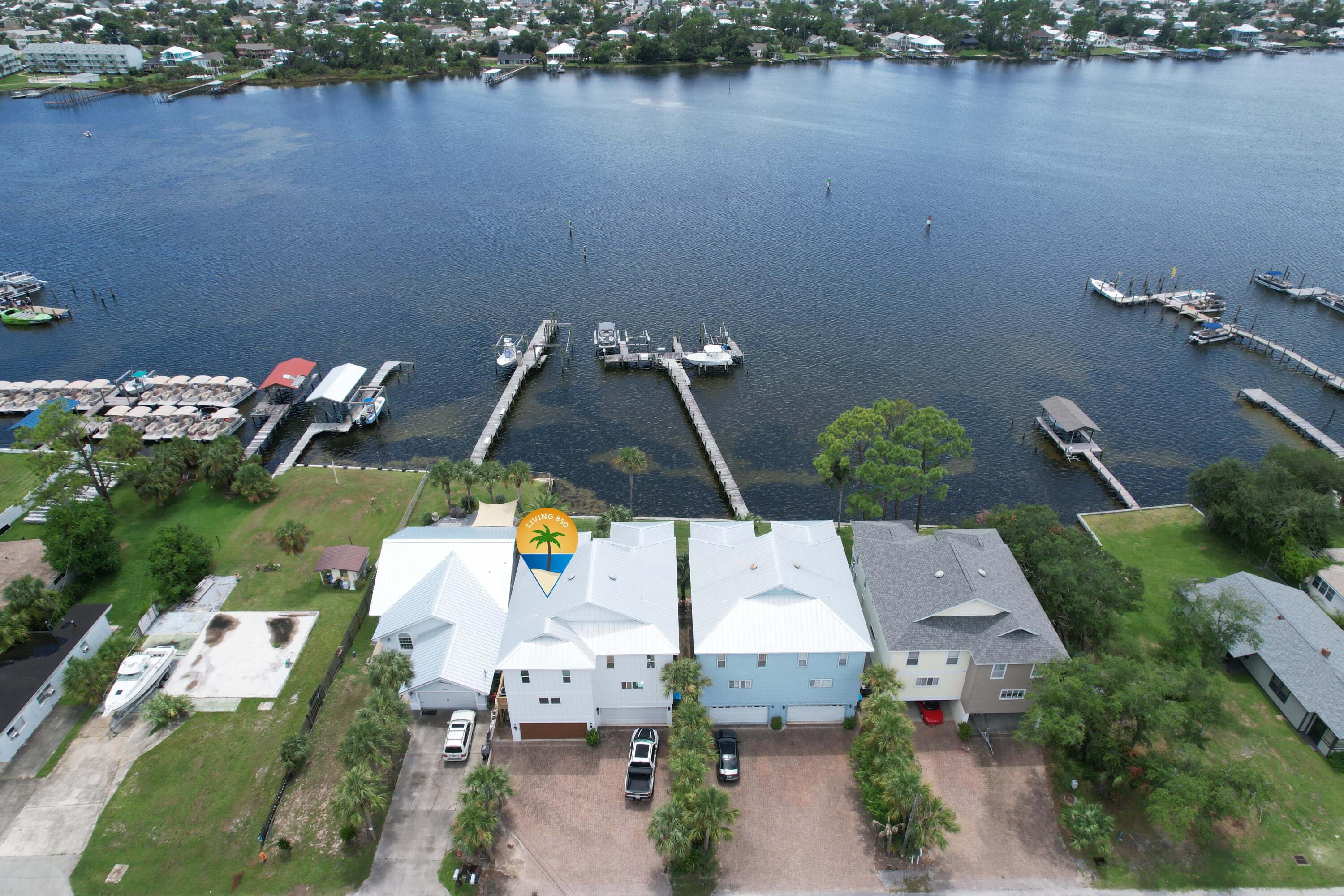 Waterfront! Short Term rental allowed on North Lagoon in PCB! Bring your boat and enjoy life on Grand Lagoon! Just like new and under $1m! The seller has just completed adding a garage and awesome bonus room complete with Murphy bed on first level. New metal roof, hardy board siding, new floors, new HVAC, impact doors and windows, new gas range, shiplap walls and more! Open floor plan on main level allows you views from every room, and your master bedroom allows you to wake up to the water. 3 great porch options to take advantage of the outdoors and sip a beverage, dine al fresco, read, or watch the dolphins. Boat slip with lift and jet ski slip. Located at the east end of Grand Lagoon, you can be in the Gulf of Mexico fishing in minutes. Perfect for full time or part time living!